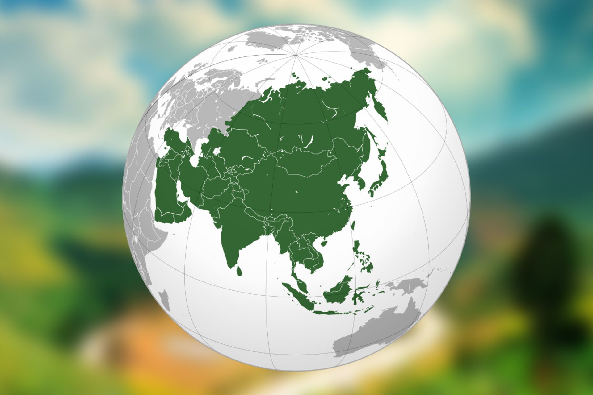 A photo of a white globe with a country in green on a green matte image